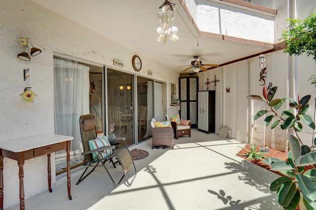 sunroom featuring ceiling fan