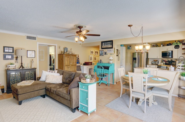 tiled living room with crown molding, a textured ceiling, and ceiling fan with notable chandelier