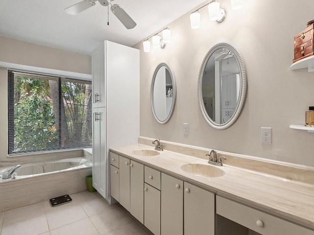 bathroom with tiled bath, ceiling fan, tile patterned flooring, and double vanity