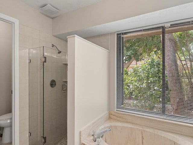 bathroom with plus walk in shower and toilet