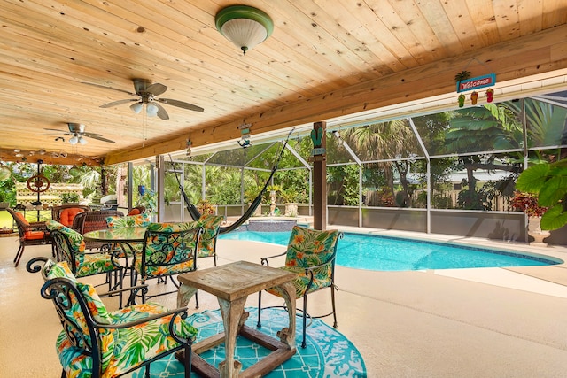 view of pool featuring a patio, a lanai, and ceiling fan