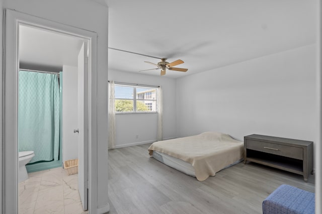 bedroom featuring light wood-type flooring and ceiling fan