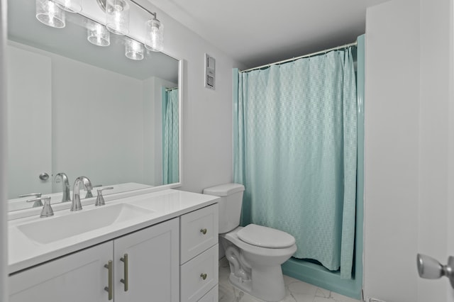 bathroom featuring tile patterned floors, toilet, and vanity