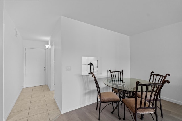 dining area with light wood-type flooring