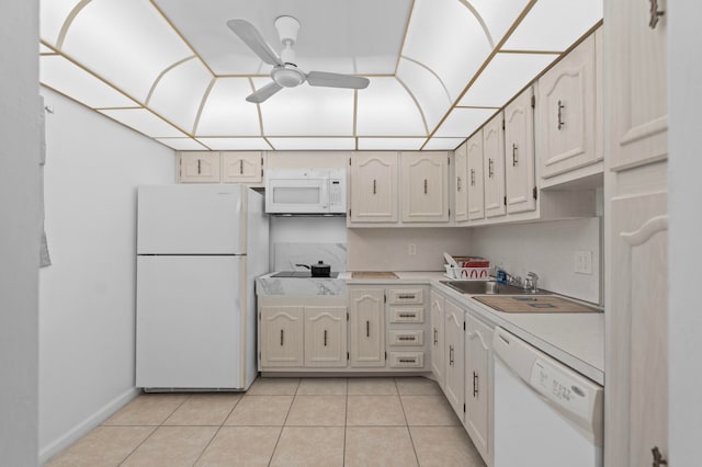 kitchen featuring sink, ceiling fan, light tile patterned floors, and white appliances