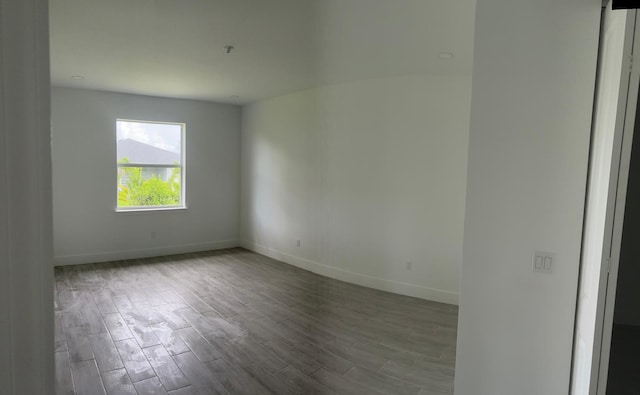 spare room featuring hardwood / wood-style flooring