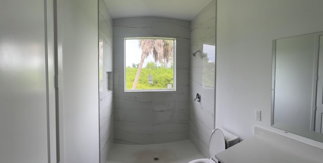 bathroom with a tile shower