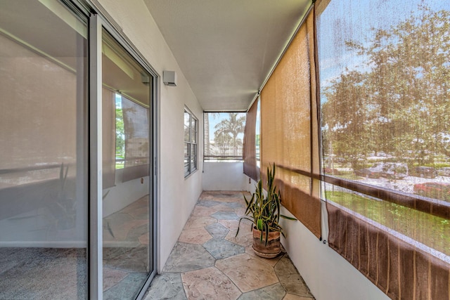 unfurnished sunroom featuring plenty of natural light