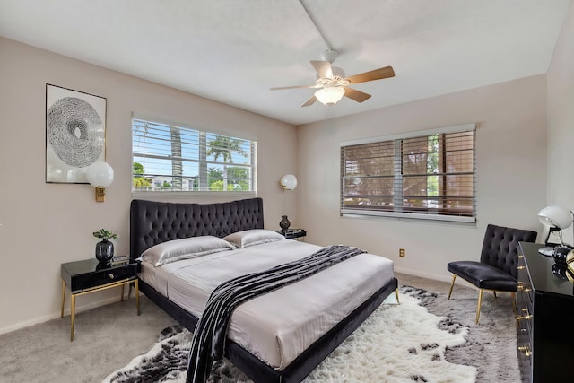 bedroom featuring light carpet and ceiling fan