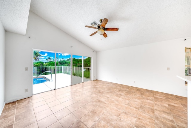 unfurnished living room featuring ceiling fan, light tile patterned flooring, a textured ceiling, and high vaulted ceiling