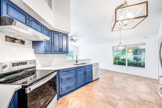 kitchen featuring sink, decorative light fixtures, stainless steel appliances, and blue cabinets