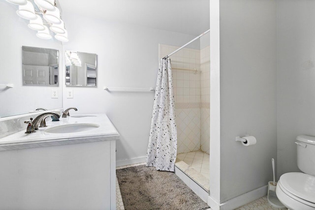 bathroom with vanity, tile patterned floors, a shower with curtain, and toilet