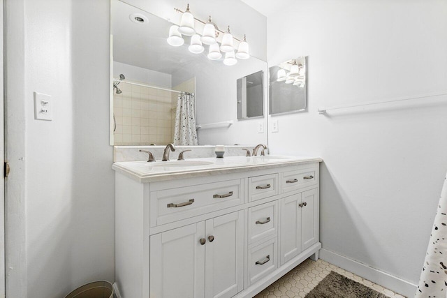 bathroom with tile patterned floors and double sink vanity