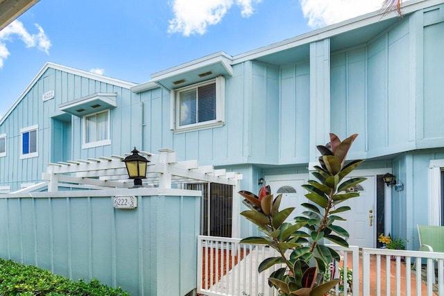 view of side of home featuring a pergola