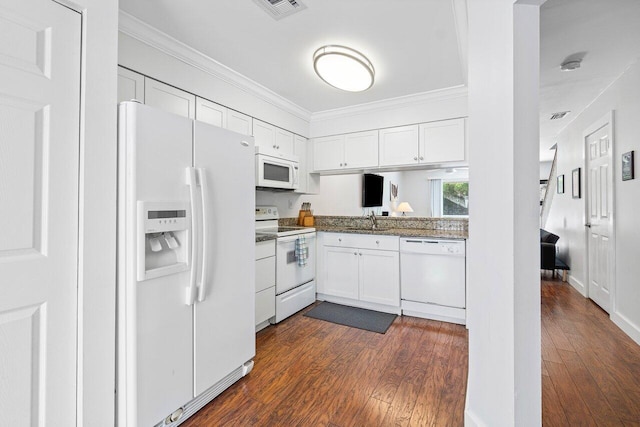 kitchen with dark hardwood / wood-style flooring, white cabinetry, and white appliances