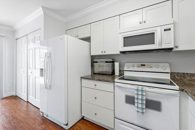 kitchen with white appliances, dark hardwood / wood-style floors, dark stone countertops, white cabinetry, and ornamental molding