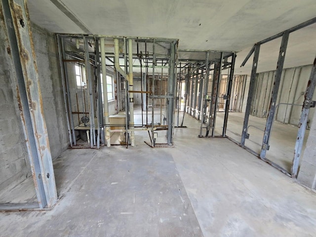 misc room with concrete flooring