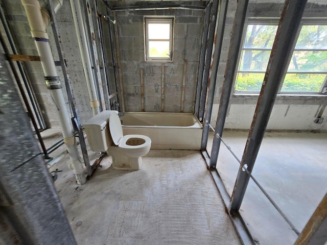 bathroom featuring plenty of natural light and toilet