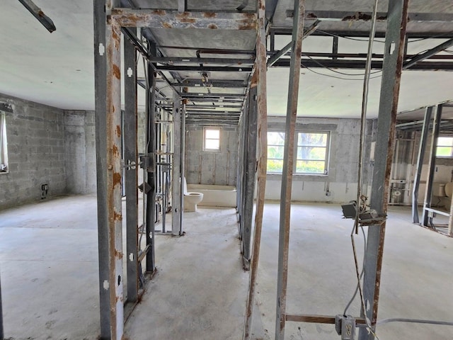 misc room with plenty of natural light and concrete floors