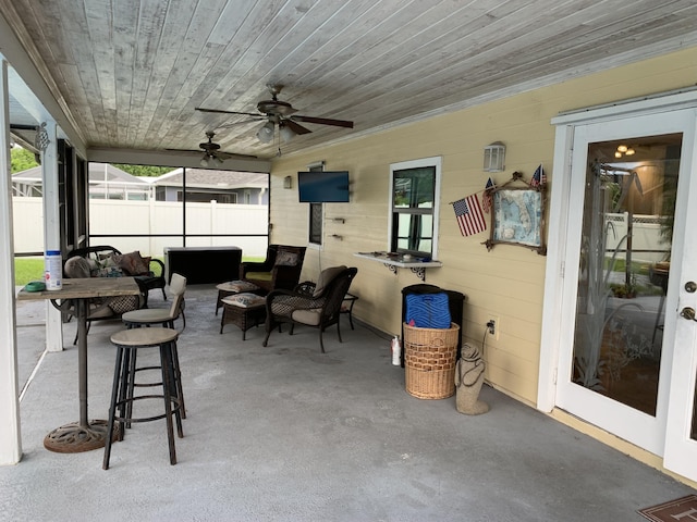 sunroom / solarium featuring wooden ceiling