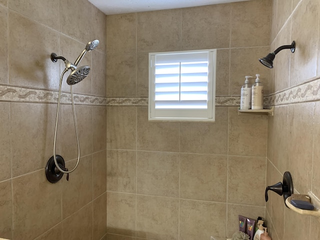 bathroom with tiled shower