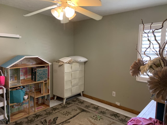 miscellaneous room featuring ceiling fan