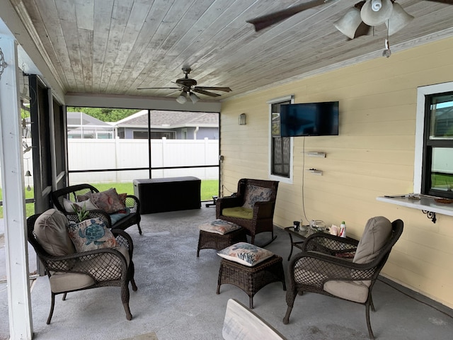 sunroom / solarium with wooden ceiling and ceiling fan