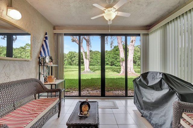 sunroom / solarium with ceiling fan and a healthy amount of sunlight