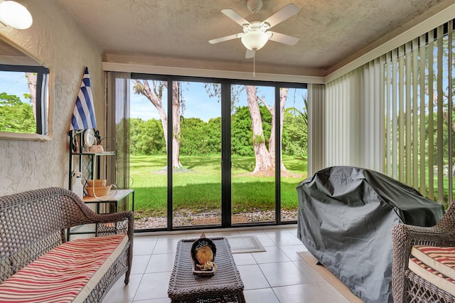 sunroom / solarium with ceiling fan and a healthy amount of sunlight