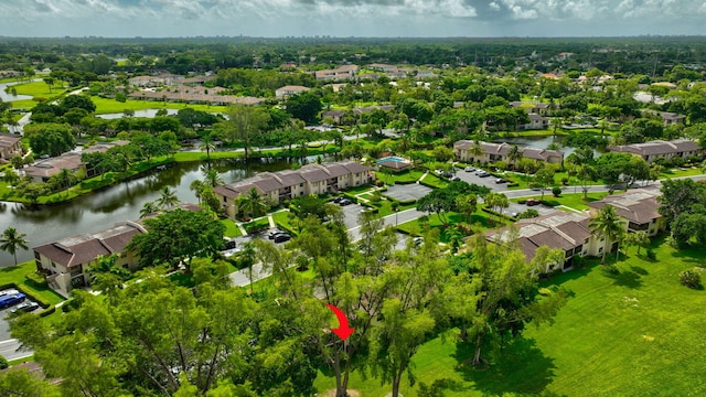 bird's eye view featuring a residential view and a water view