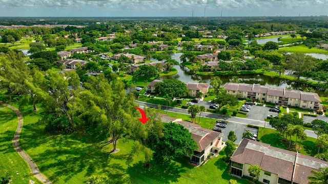 birds eye view of property with a water view and a residential view