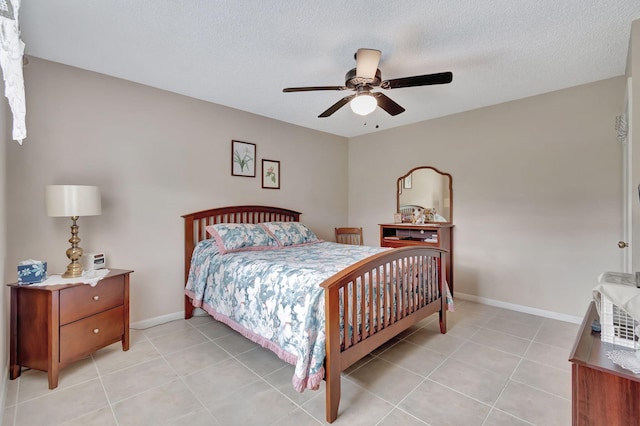 tiled bedroom featuring a textured ceiling and ceiling fan