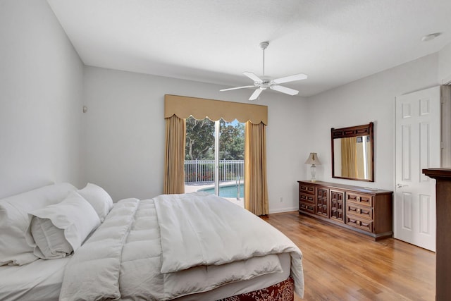 bedroom featuring ceiling fan, light wood-type flooring, and access to outside