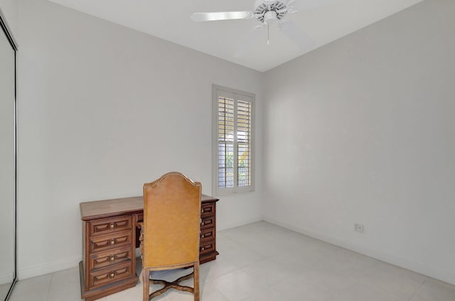 office area with baseboards and a ceiling fan