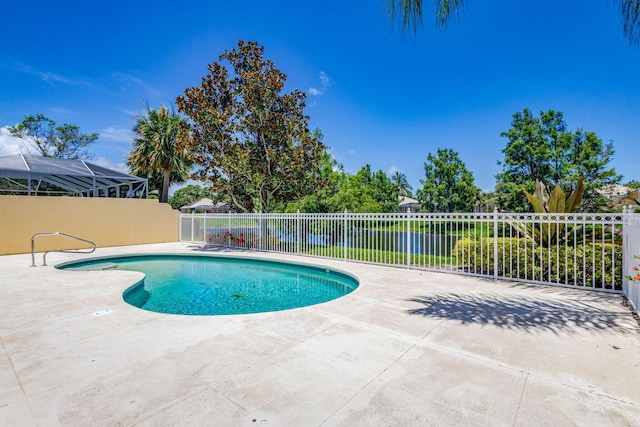 view of swimming pool with a lanai and a patio area