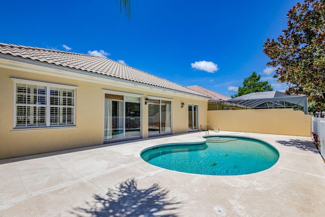 view of swimming pool featuring a fenced in pool, a patio, and fence