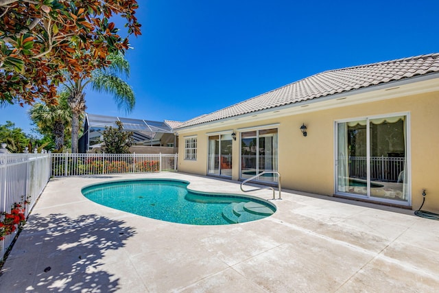 view of pool featuring a lanai and a patio