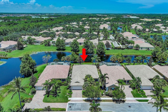 birds eye view of property featuring a water view and a residential view