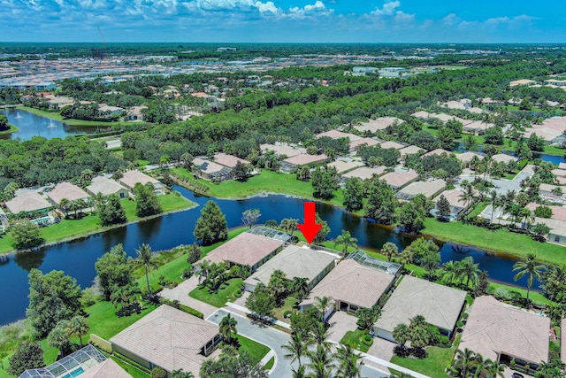 birds eye view of property with a water view and a residential view