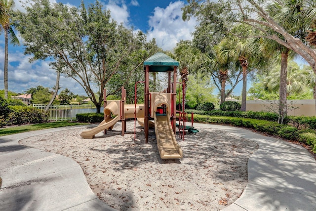 communal playground featuring fence