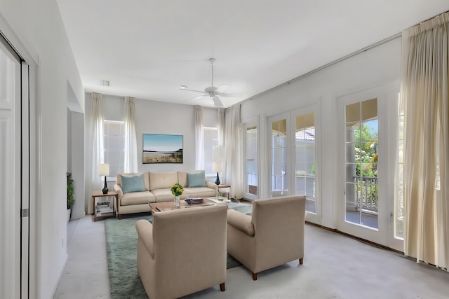 living room with french doors and ceiling fan