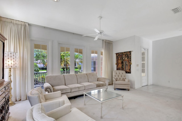 living room featuring light colored carpet and ceiling fan