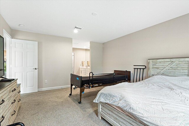 bedroom with light colored carpet