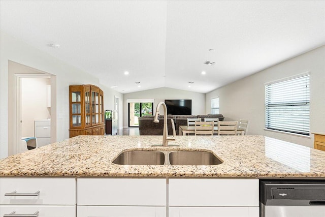 kitchen featuring sink, a wealth of natural light, lofted ceiling, and white cabinets