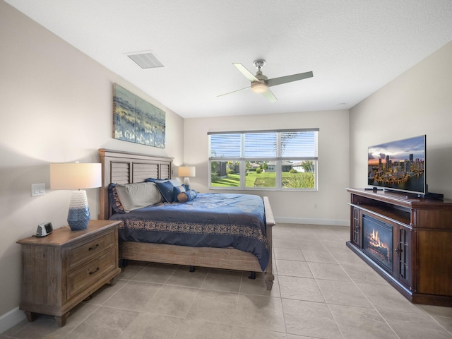 bedroom featuring ceiling fan and light tile patterned floors