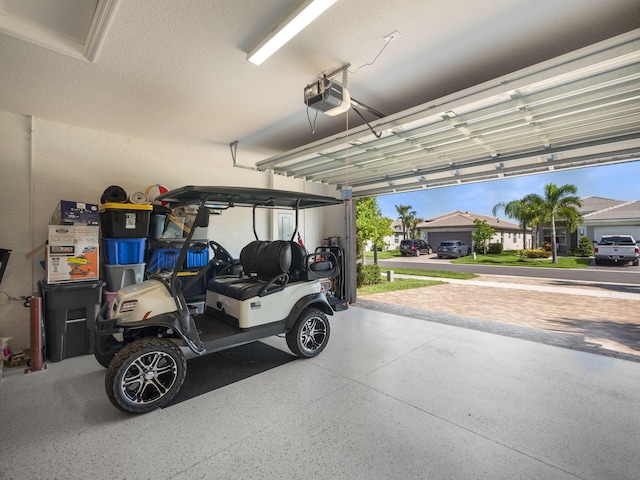 garage featuring a garage door opener