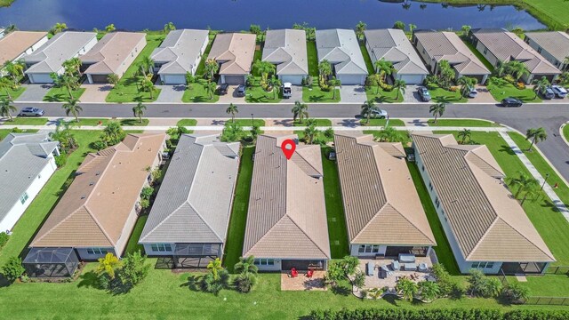 birds eye view of property featuring a water view