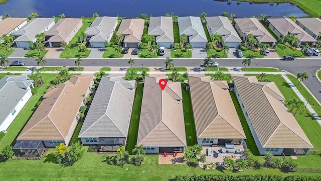 birds eye view of property with a water view