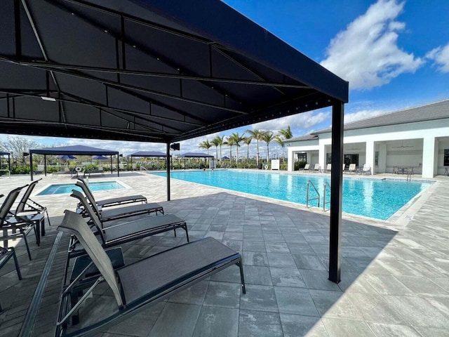 view of swimming pool featuring a patio