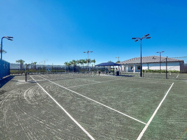 view of tennis court with a gazebo